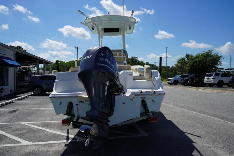 Slide: The Image of 2016 Sea Fox 246 Commander boat with Yamaha outboard motor in a parking lot. - 6
