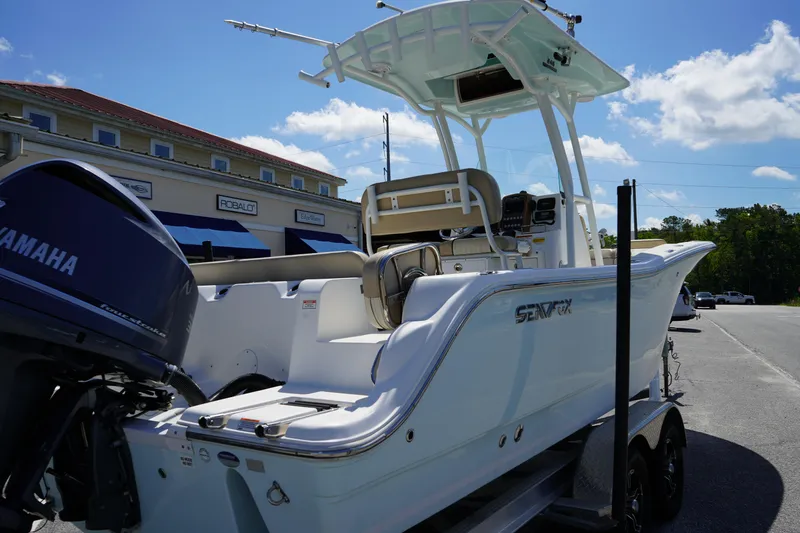 Slide: The Image of 2016 Sea Fox 246 Commander boat with Yamaha engine on trailer, parked outdoors. - 7