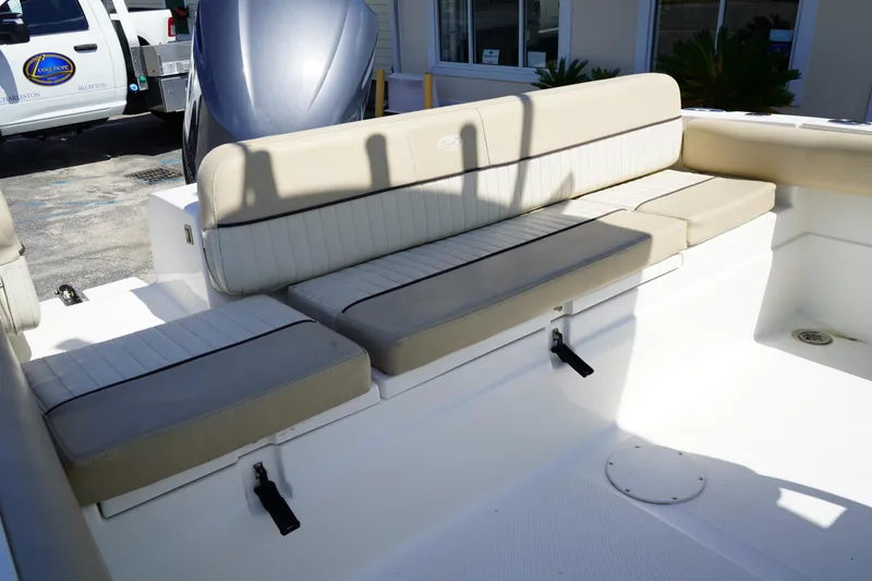 Slide: The Image of 2016 Sea Fox 246 Commander boat interior with beige cushioned seating. - 9