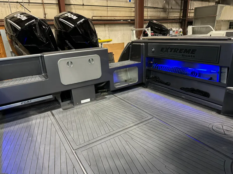 Slide: The Image of 2020 Extreme Boats 795 Walk Around interior with dual engines and illuminated storage. - 4