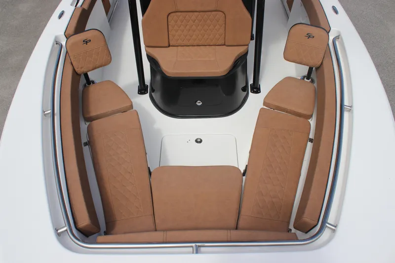 Slide: The Image of 2025 Sea Pro 222 boat interior with tan cushioned seating and sleek design. - 17