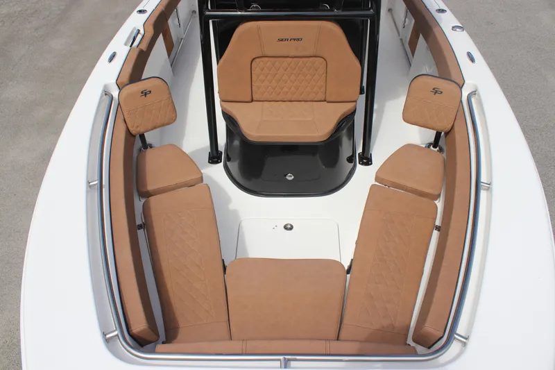 Slide: The Image of 2025 Sea Pro 222 boat interior with tan seating and sleek design. - 18