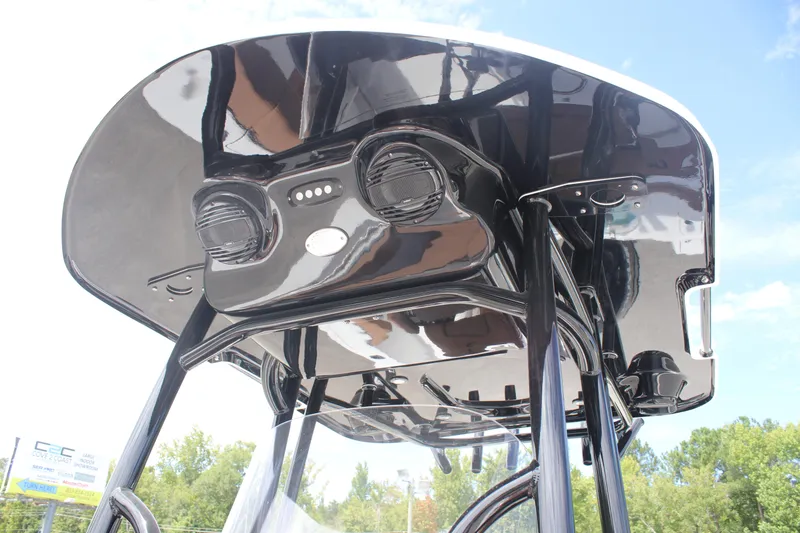 Slide: The Image of 2025 Sea Pro 222 boat T-top with integrated speakers and sleek black finish. - 19
