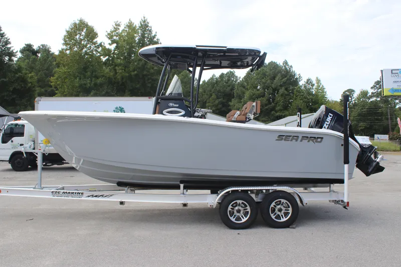Slide: The Image of 2025 Sea Pro 222 boat on trailer, parked outdoors, side view. - 4