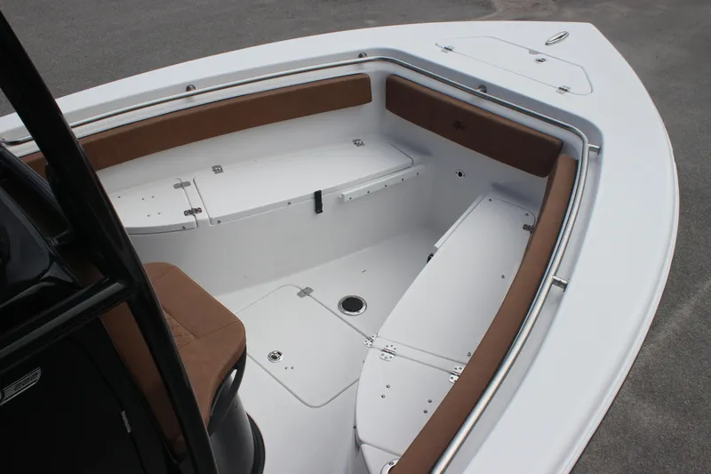 Slide: The Image of 2025 Sea Pro 222 boat interior with white deck and brown seating. - 5