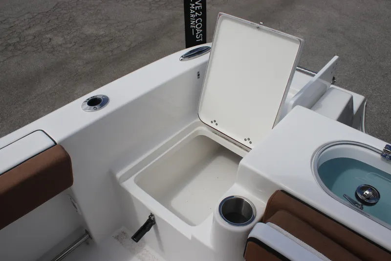 Slide: The Image of 2025 Sea Pro 222 boat interior with open storage compartment and seating. - 9