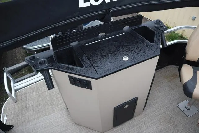 Slide: The Image of 2017 Lowe SF 232 boat console with wet surface and seating area. - 16