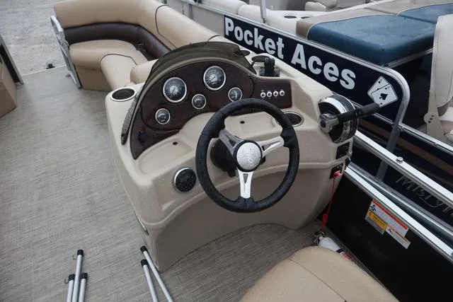 Slide: The Image of 2017 Lowe SF 232 boat dashboard with steering wheel and controls. - 9