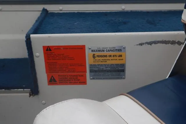 Slide: The Image of 1999 Lowe Sea Nymph 160 BT boat capacity plate, indicating maximum 6 persons or 875 lbs. - 12