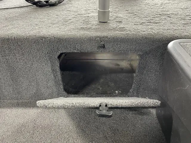 Slide: The Image of 2020 Tracker BASS TRACKER® Classic XL boat storage compartment with open hatch. - 17