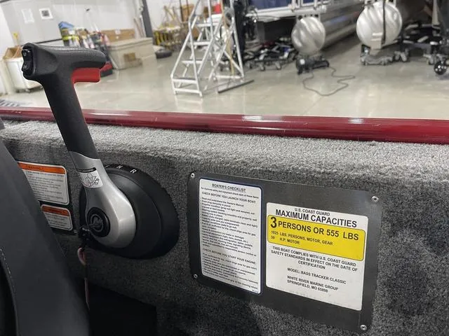 Slide: The Image of 2020 Tracker BASS TRACKER® Classic XL boat interior with capacity label and control handle. - 25
