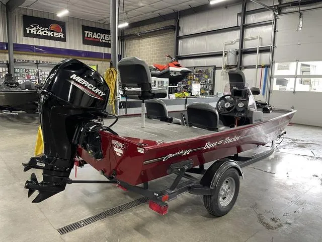 Slide: The Image of 2020 Tracker BASS TRACKER® Classic XL boat in showroom, featuring Mercury outboard motor. - 5