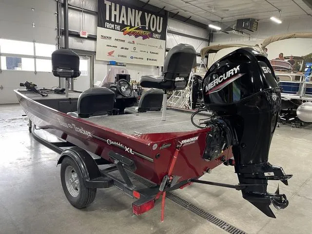 Slide: The Image of 2020 Tracker BASS TRACKER® Classic XL boat with Mercury engine in a showroom. - 9
