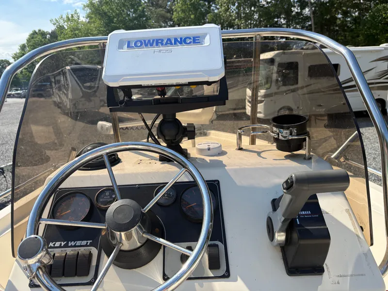 Slide: The Image of 2004 Key West 186 Bay Reef boat dashboard with Lowrance GPS and steering wheel. - 13
