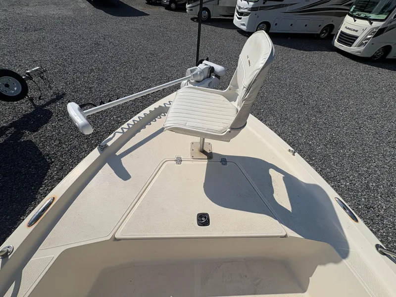 Slide: The Image of 2004 Key West 186 Bay Reef boat with a white seat and trolling motor. - 17
