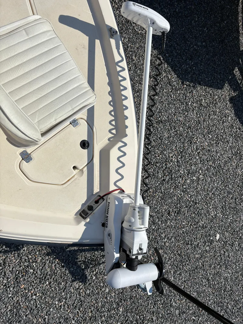 Slide: The Image of 2004 Key West 186 Bay Reef boat with trolling motor and beige seating. - 19