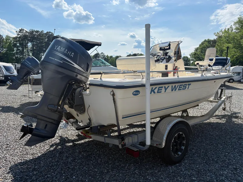 Slide: The Image of 2004 Key West 186 Bay Reef boat with Yamaha outboard motor on a trailer. - 5