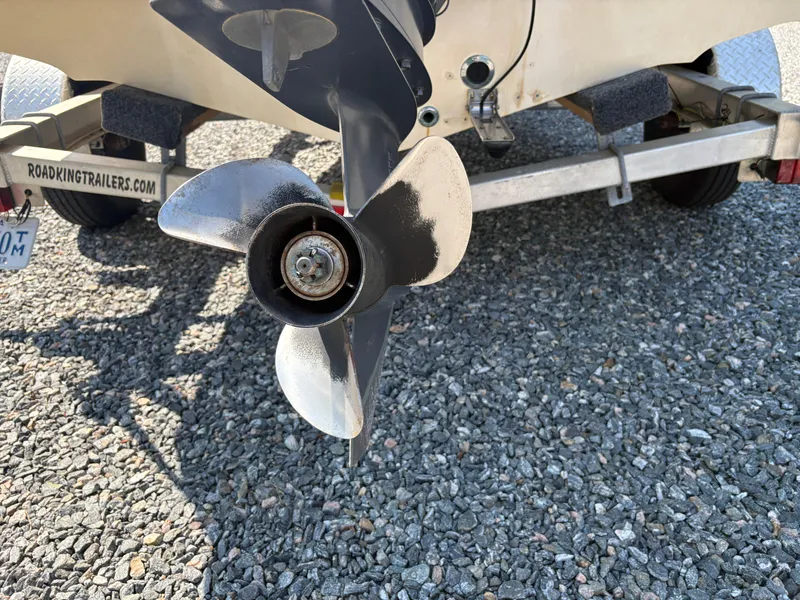 Slide: The Image of Propeller of 2004 Key West 186 Bay Reef boat on trailer, gravel background. - 8