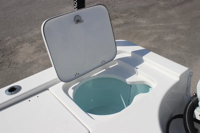 Slide: The Image of Open storage compartment on 2025 Sea Pro 230 Bay boat. - 11