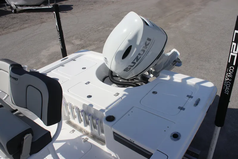 Slide: The Image of 2025 Sea Pro 230 Bay boat with Suzuki outboard motor, featuring sleek design and seating. - 12