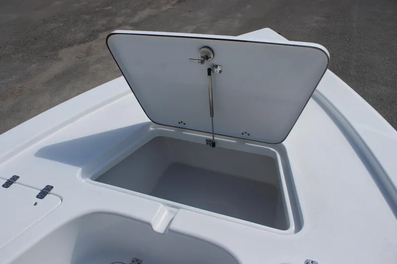 Slide: The Image of 2025 Sea Pro 230 Bay boat with open storage compartment on deck. - 25