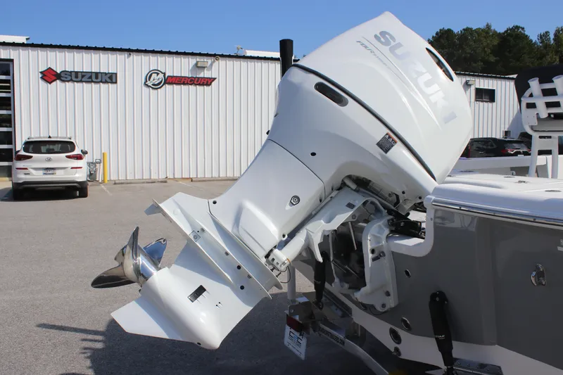 Slide: The Image of 2025 Sea Pro 230 Bay boat with Suzuki outboard motor at dealership. - 29
