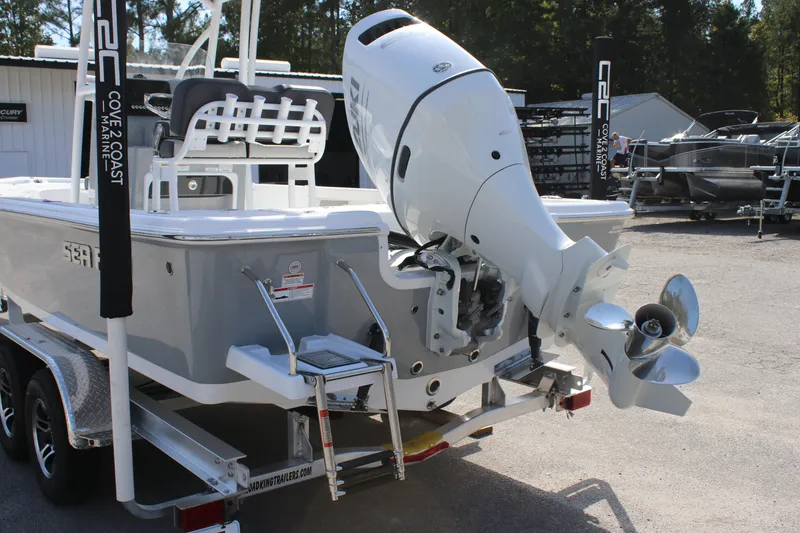 Slide: The Image of 2025 Sea Pro 230 Bay boat with powerful outboard motor on trailer. - 4