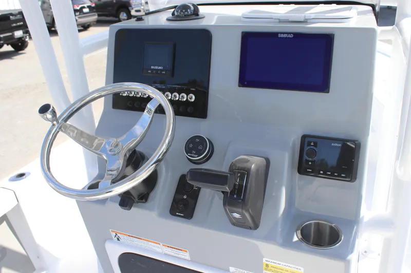 Slide: The Image of 2025 Sea Pro 230 Bay boat console with steering wheel and electronic displays. - 8