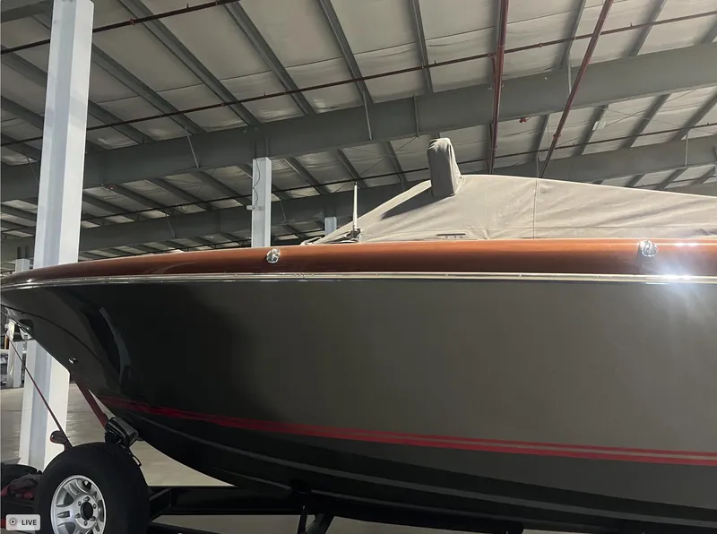 Slide: The Image of 2013 Riva Aquariva 33 boat in storage, covered and on a trailer. - 22