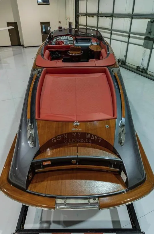 Slide: The Image of 2013 Riva Aquariva 33 luxury boat with red seating, displayed indoors. - 25