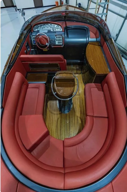 Slide: The Image of Luxurious 2013 Riva Aquariva 33 interior with red leather seating and elegant wood finish. - 35