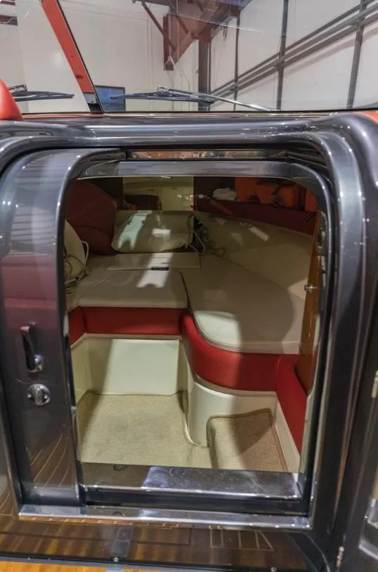 Slide: The Image of Interior view of 2013 Riva Aquariva 33 boat, featuring luxurious seating and elegant design. - 40