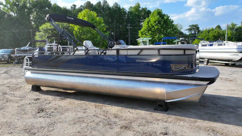 The Image of 2025 Tahoe Pontoon Sport 85 Versatile Rear Bench, blue, parked outdoors. - 0