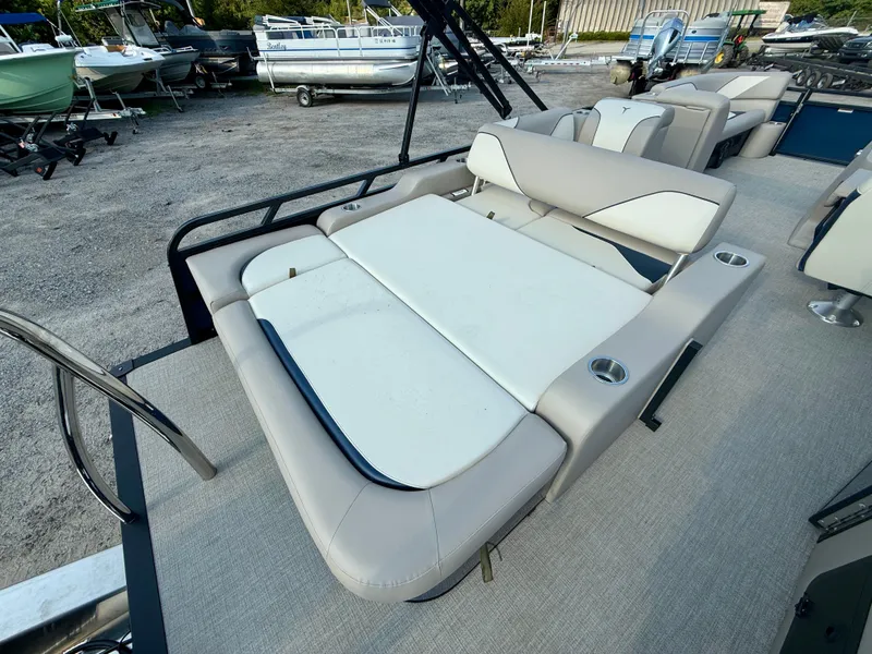 Slide: The Image of 2025 Tahoe Pontoon Sport 85 Versatile Rear Bench with beige seating and cup holders. - 15