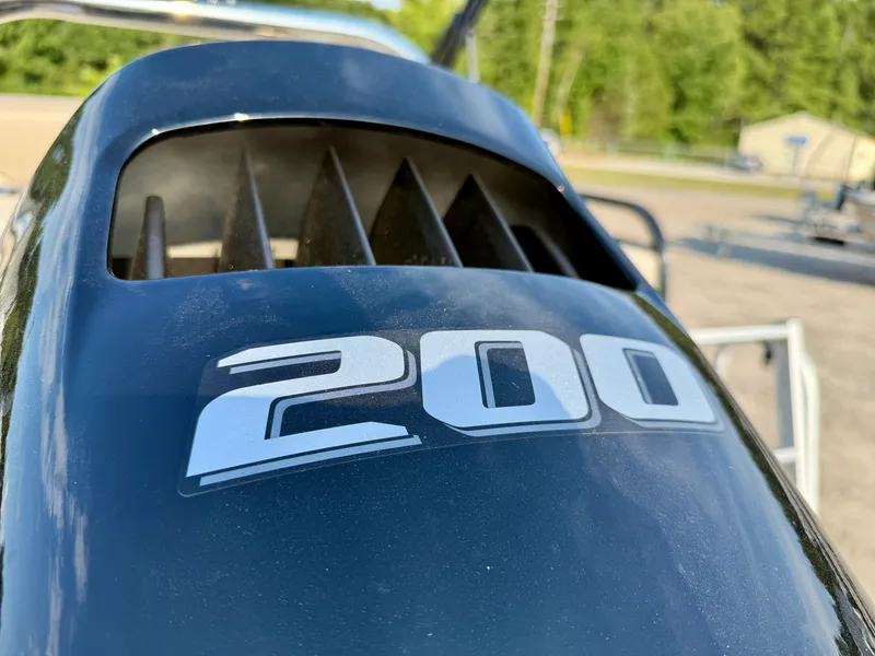 Slide: The Image of Close-up of a 200 horsepower engine on a 2025 Tahoe Pontoon Sport 85. - 18