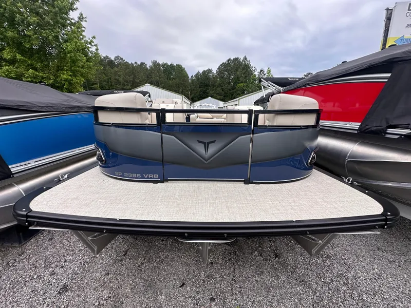 Slide: The Image of 2025 Tahoe Pontoon Sport 85 Versatile Rear Bench, docked with sleek design and spacious seating. - 4