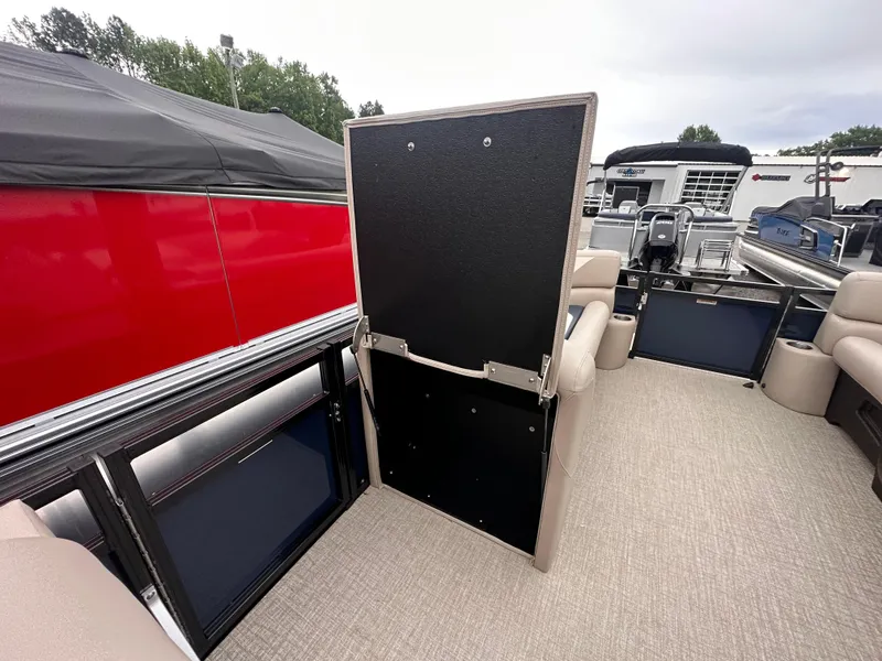 Slide: The Image of 2025 Tahoe Pontoon Sport 85 Versatile Rear Bench interior with open storage compartment. - 5