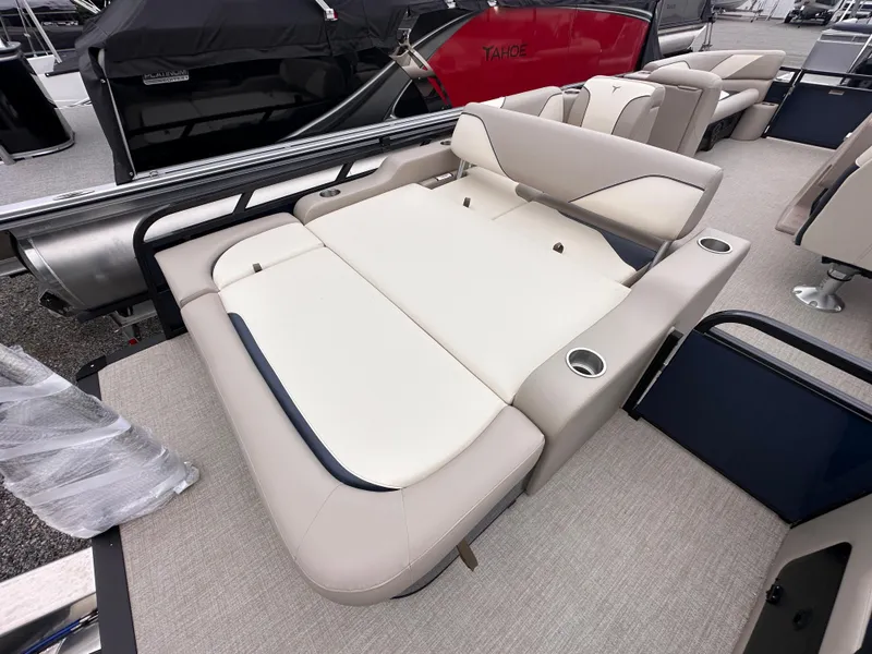 Slide: The Image of 2025 Tahoe Pontoon Sport 85 Versatile Rear Bench with beige seating and cup holders. - 7
