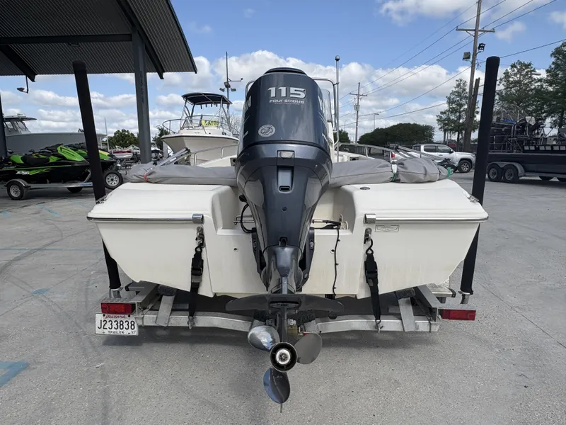 Slide: The Image of 2005 Scout 17 boat with 115 horsepower outboard motor on a trailer. - 10