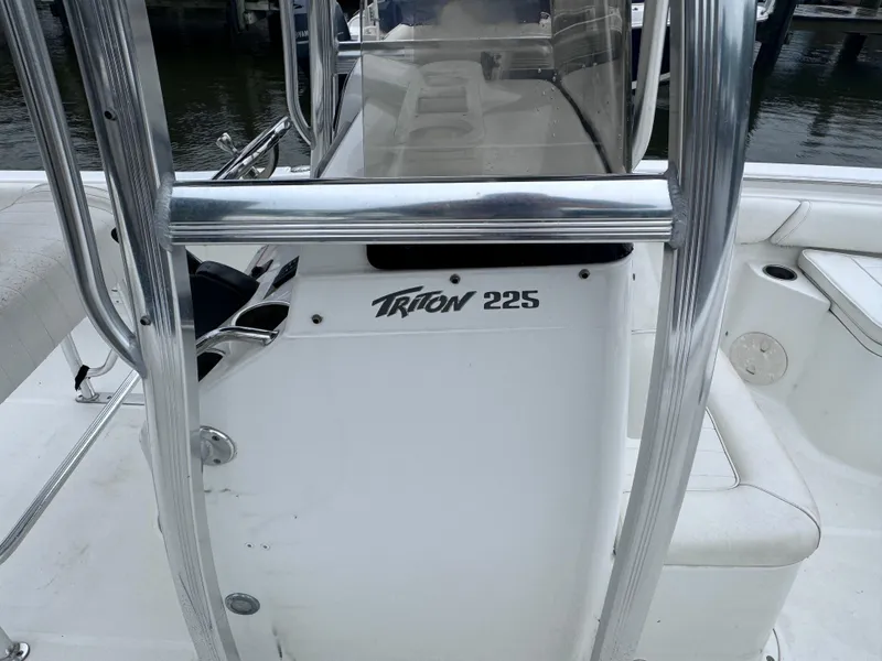 Slide: The Image of 2011 Sea Hunt Triton 225 boat console with stainless steel railings. - 12