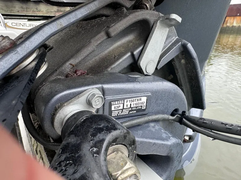 Slide: The Image of Close-up of a Yamaha motor part on a 2011 Sea Hunt Triton 225 boat. - 5
