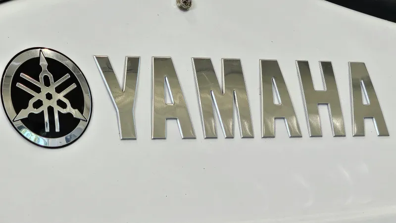 Slide: The Image of Yamaha logo on 2017 Yamaha Boats 212X, featuring sleek metallic lettering. - 25