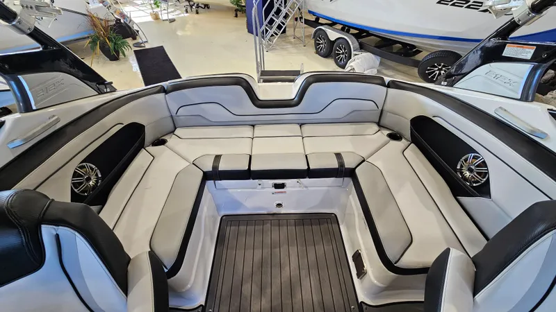 Slide: The Image of 2017 Yamaha Boats 212X interior with spacious seating and sleek design. - 7