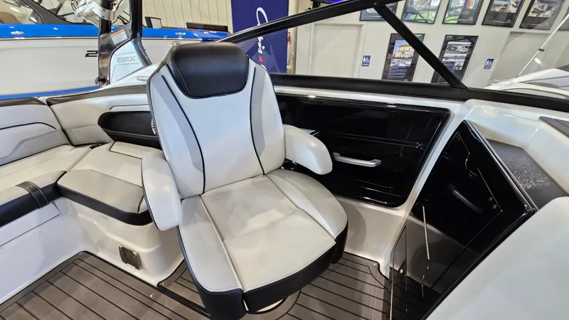 Slide: The Image of 2017 Yamaha Boats 212X interior with sleek captain's chair and modern design. - 9