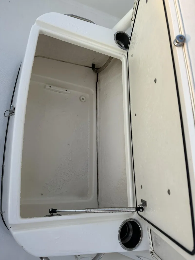 Slide: The Image of Open storage compartment on a 2009 Edgewater 318CC boat, showcasing interior space. - 15
