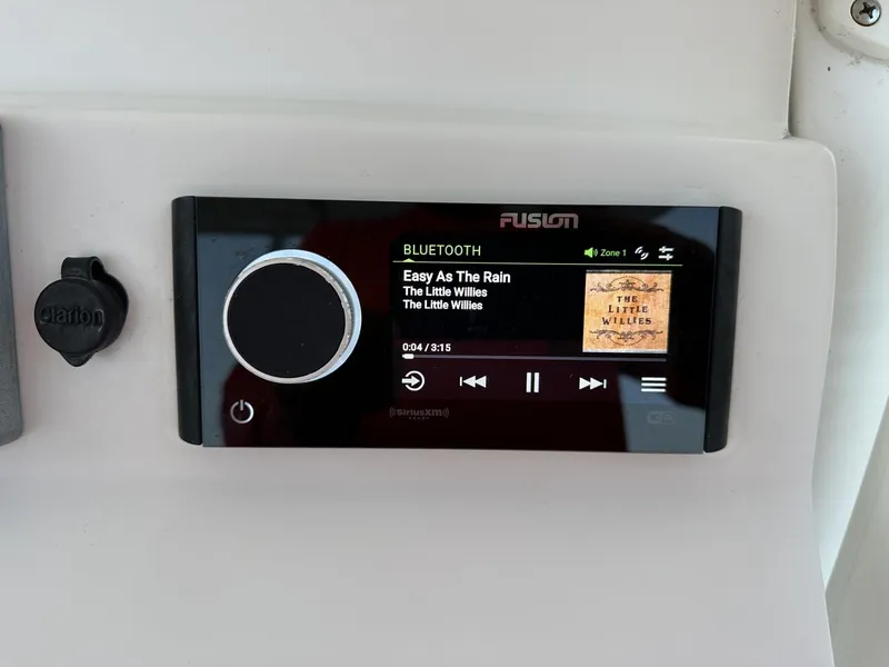 Slide: The Image of Fusion stereo system on 2009 Edgewater 318CC playing "Easy As The Rain" by The Little Willies. - 28