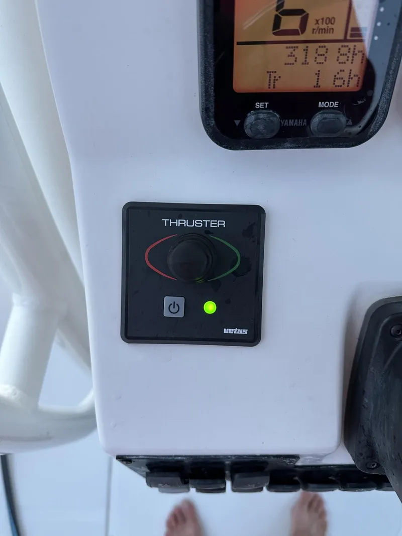 Slide: The Image of Control panel of a 2009 Edgewater 318CC boat with thruster and display. - 30