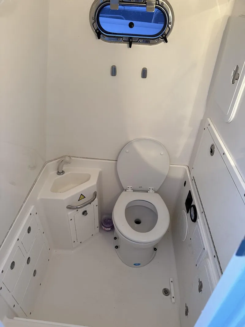 Slide: The Image of 2009 Edgewater 318CC boat bathroom with toilet and sink. - 31