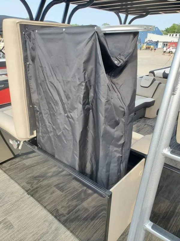 Slide: The Image of 2024 Avalon Catalina Entertainer Funship interior with black privacy curtain feature. - 14