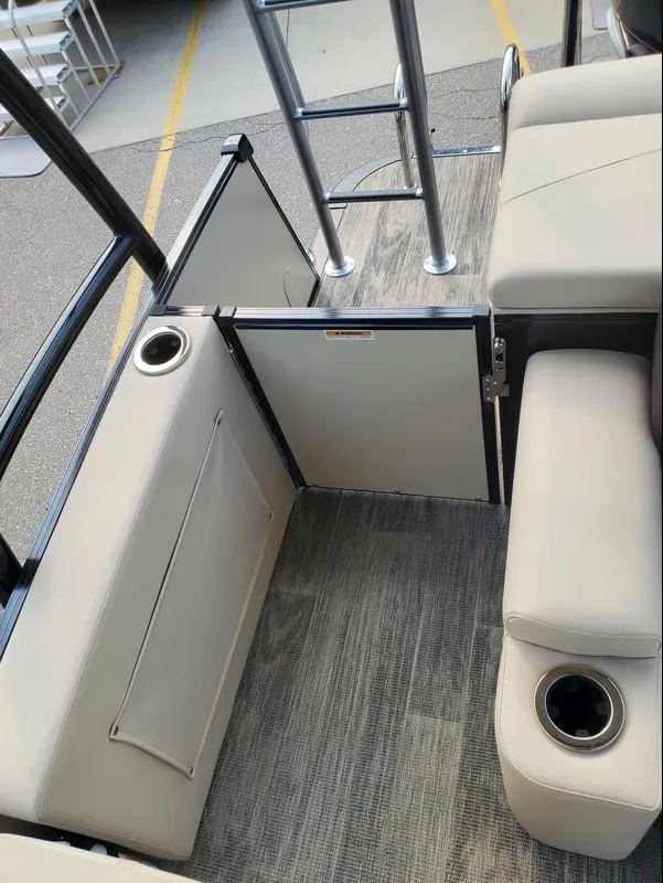 Slide: The Image of 2024 Avalon Catalina Entertainer Funship interior with seating, cup holders, and ladder. - 15